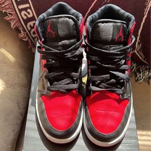 Gym Red Jordan 1 Mid. Size 6 in kids and a 7.5 in women’s.